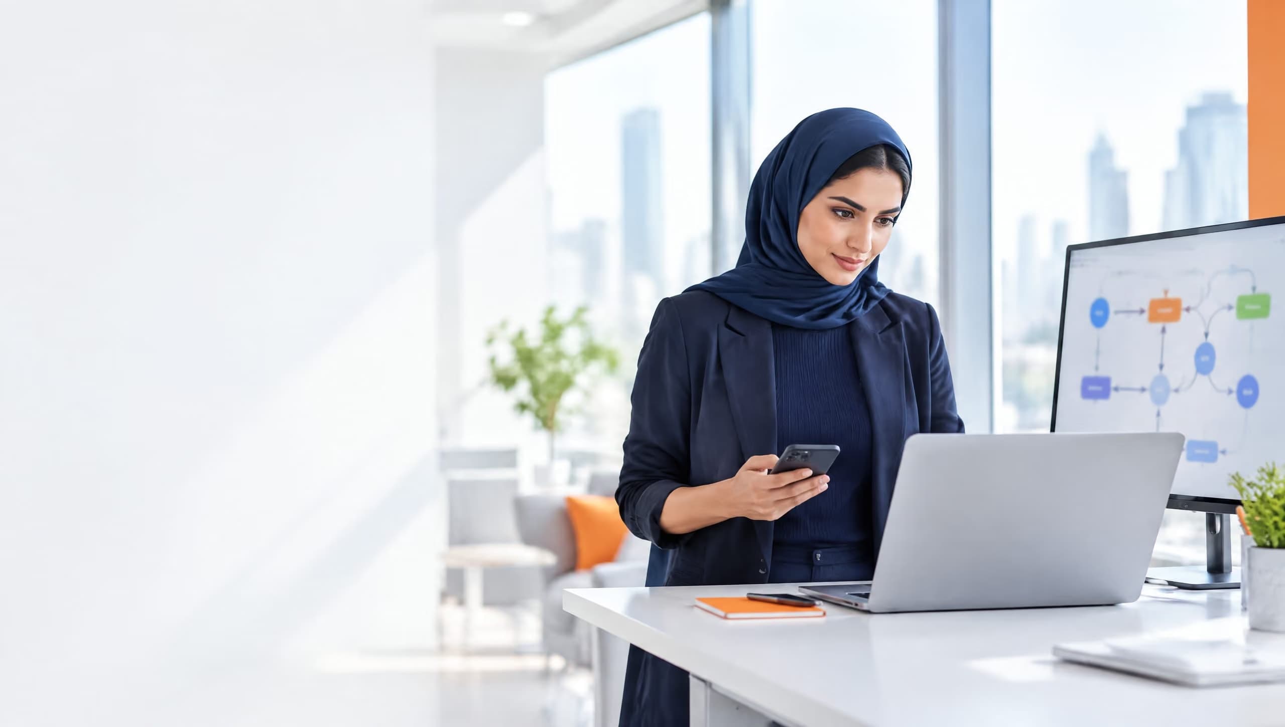 Operations manager checking an automated workflow on her laptop and phone
